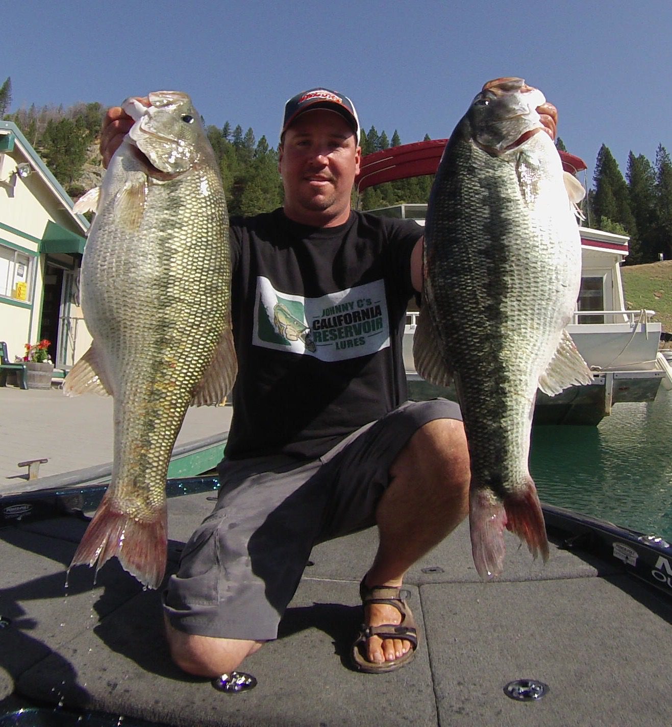 Fisherman displaying his catch outdoors