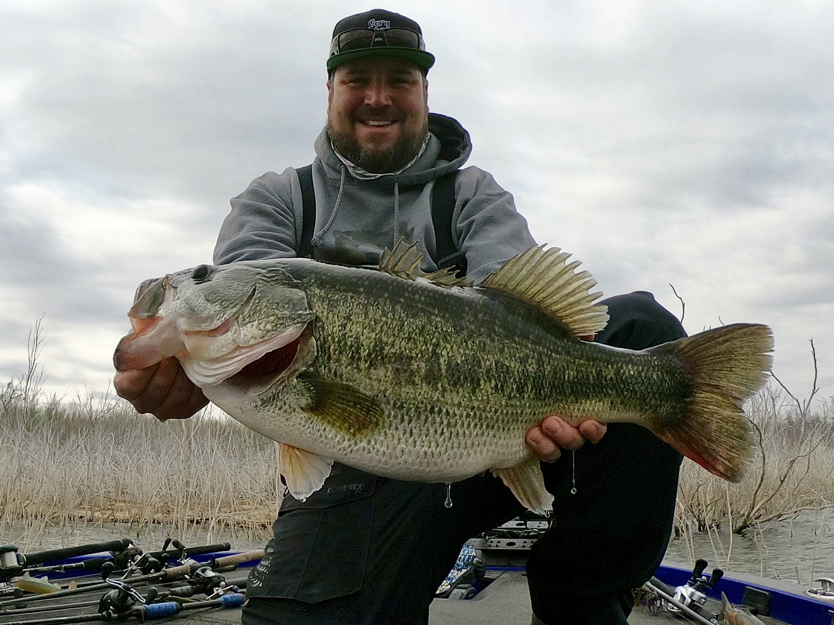 Man proudly holding large fish