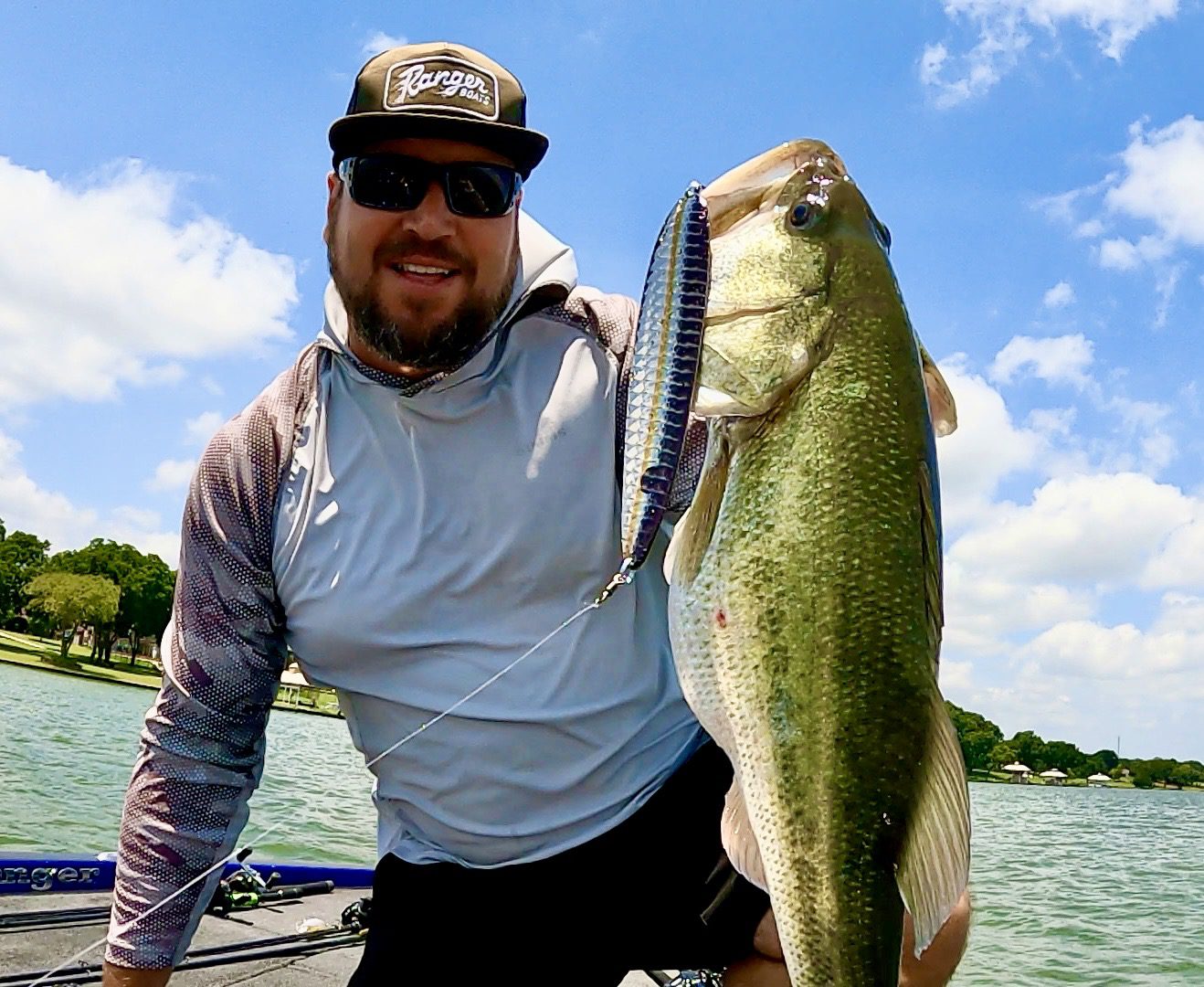 Man holding large fish on boat