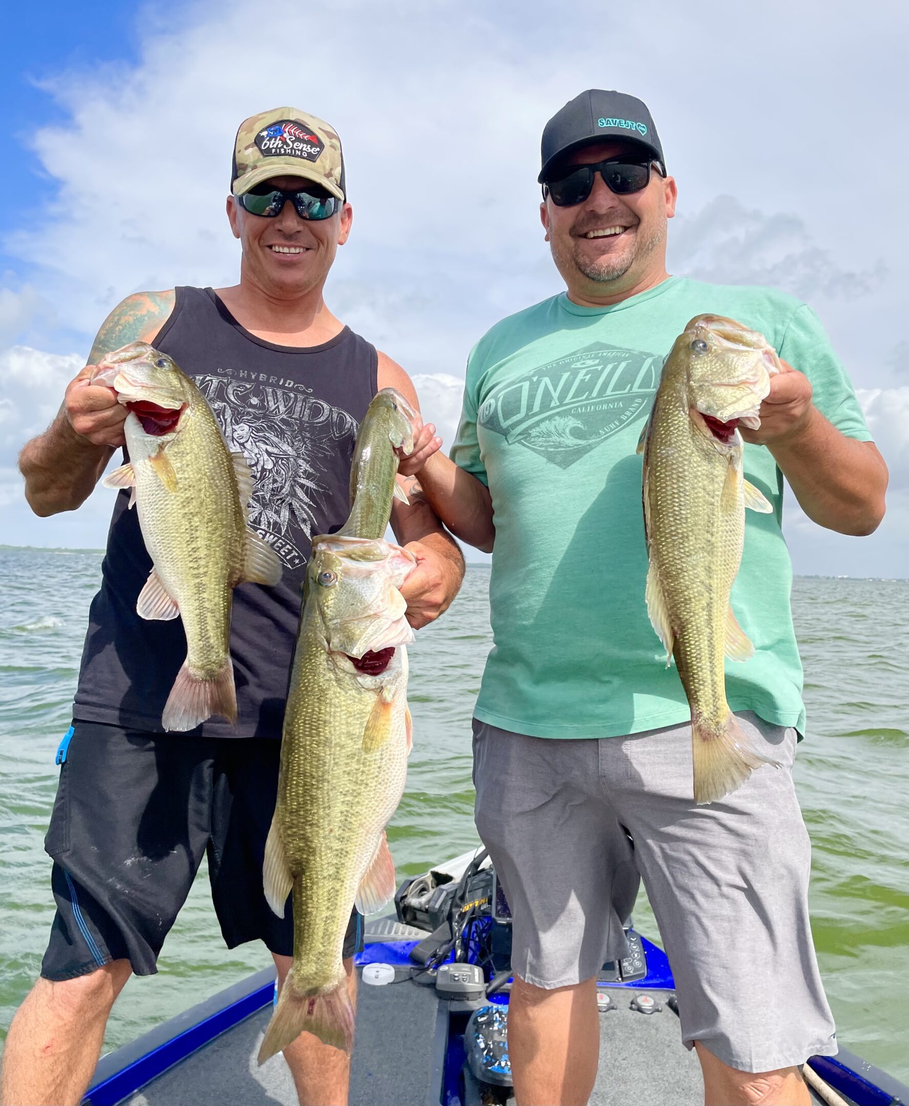 Friends showcasing their fishing catch