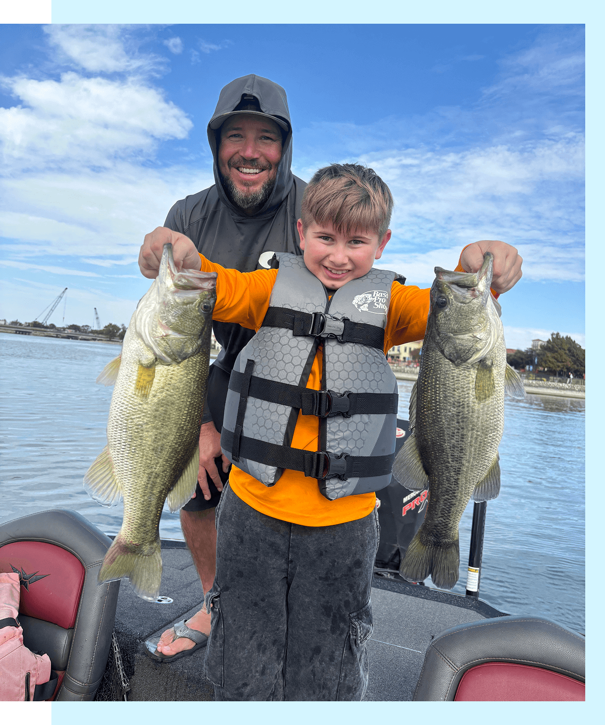 Father and son with large fish