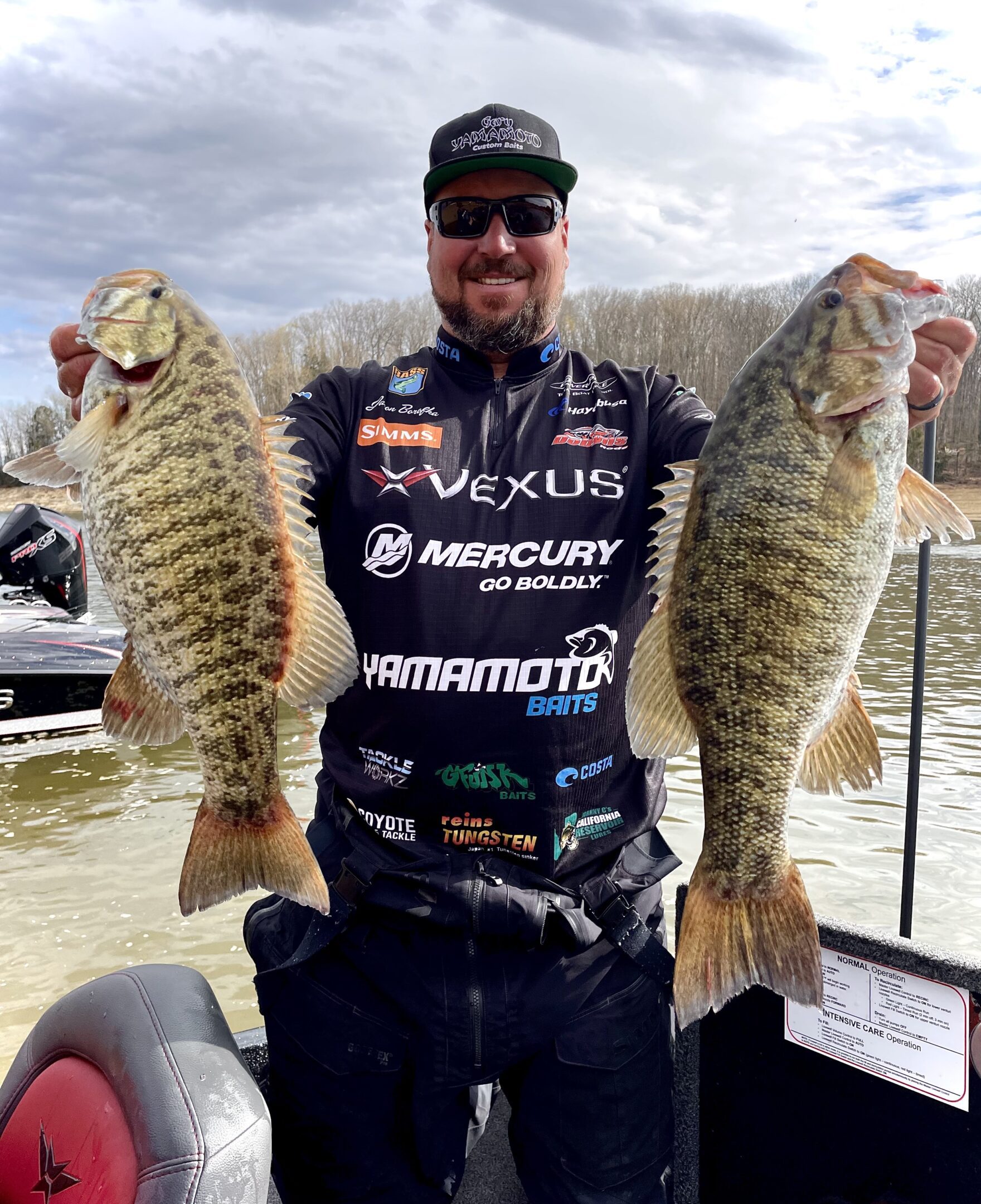 Angler holding two large fish